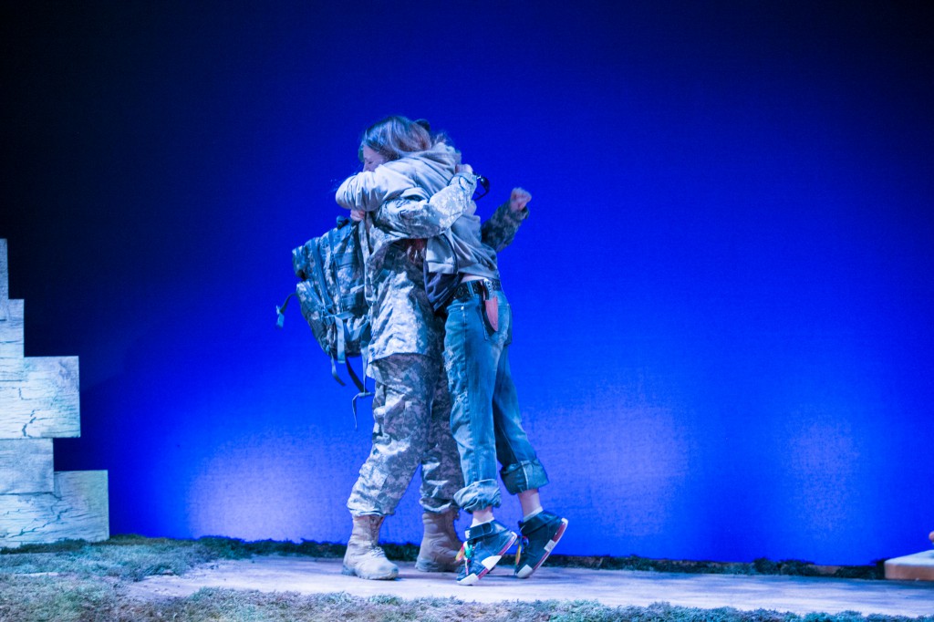 Sisters holding onto one another during Spark. Photo provided by the Theater Alliance.