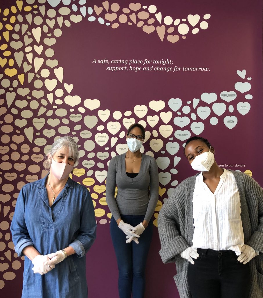 image of 3 women wearing masks in front of a purple wall at Calvary Women's Services